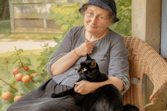Grandmasterp_an_elderly_woman_sitting_with_her_black_catillustr_41da7e80-36db-4389-91d0-317b642c41a5